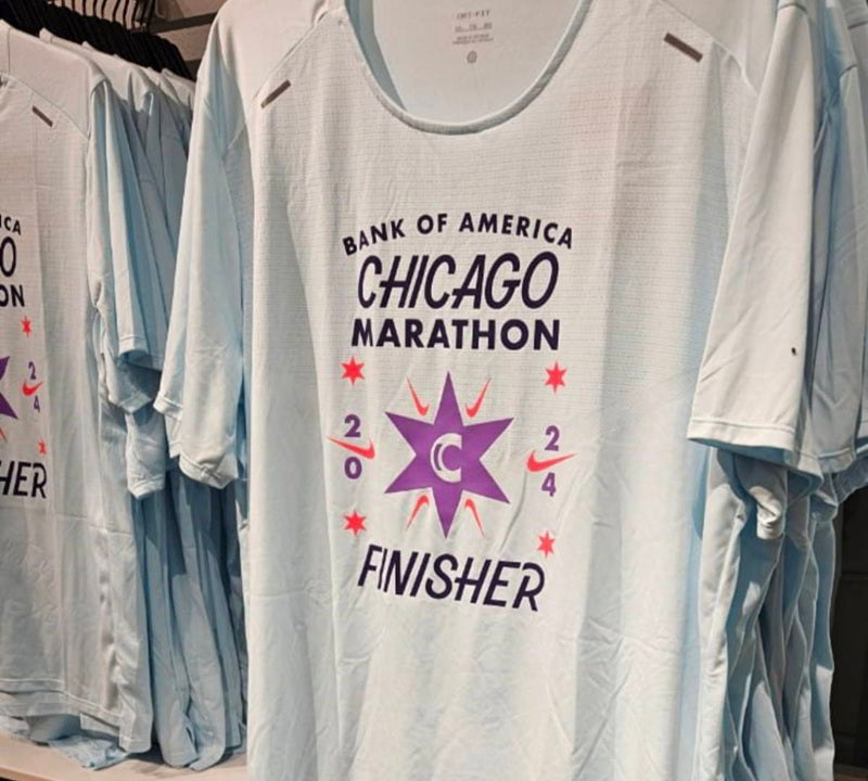 Photograph of the official Chicago Marathon 2024 shirt, hanging in a store