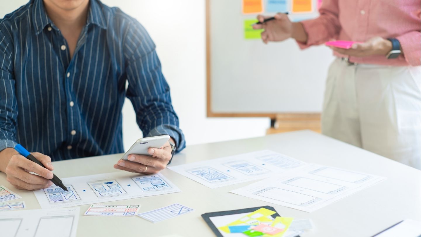 People making paper prototypes for a usability test.