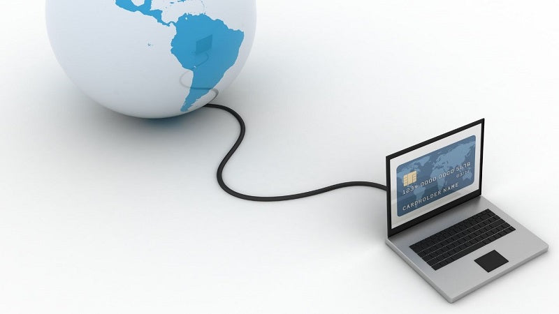 A computer connected via a cable to a globe.