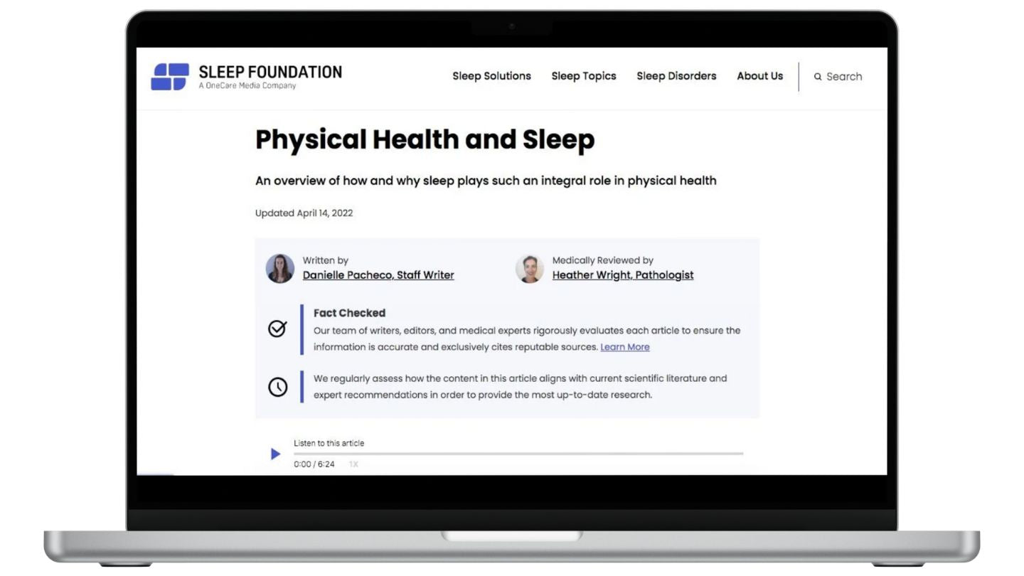 On a laptop screen, a Sleep Foundation page is visible, highlighting content creators.
